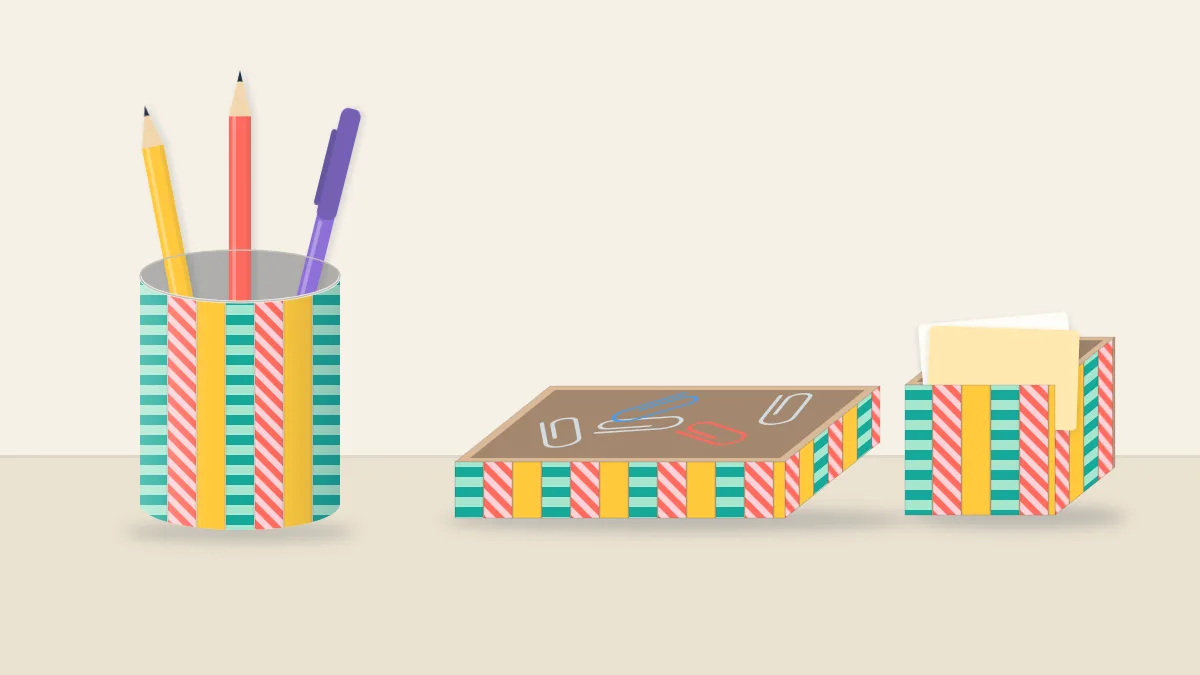A matching desk set decorated with the same washi tapes: a pen cup with pencils, a tray of paper clips and a small note box