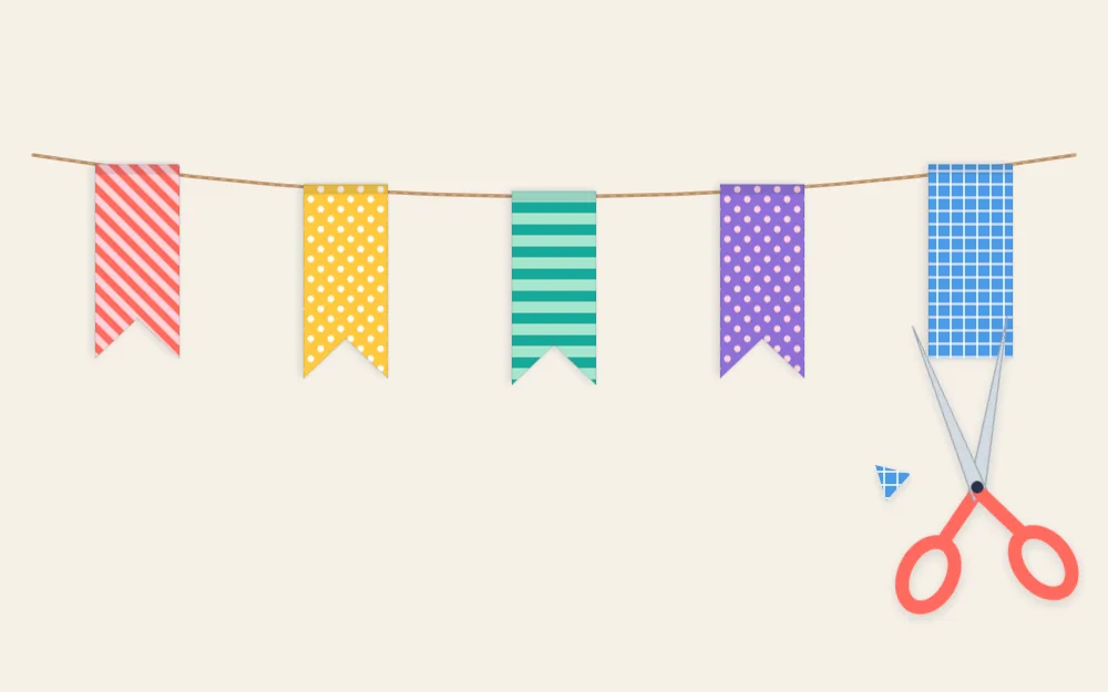 Twine with washi tape strips folded over it as fishtail flags, scissors notching the last one